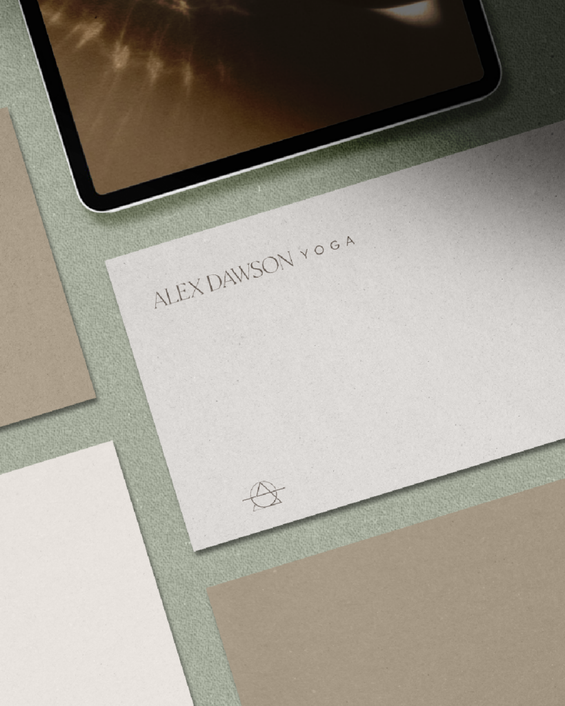 Stationery mockup for identity systems branding project on a muted green surface