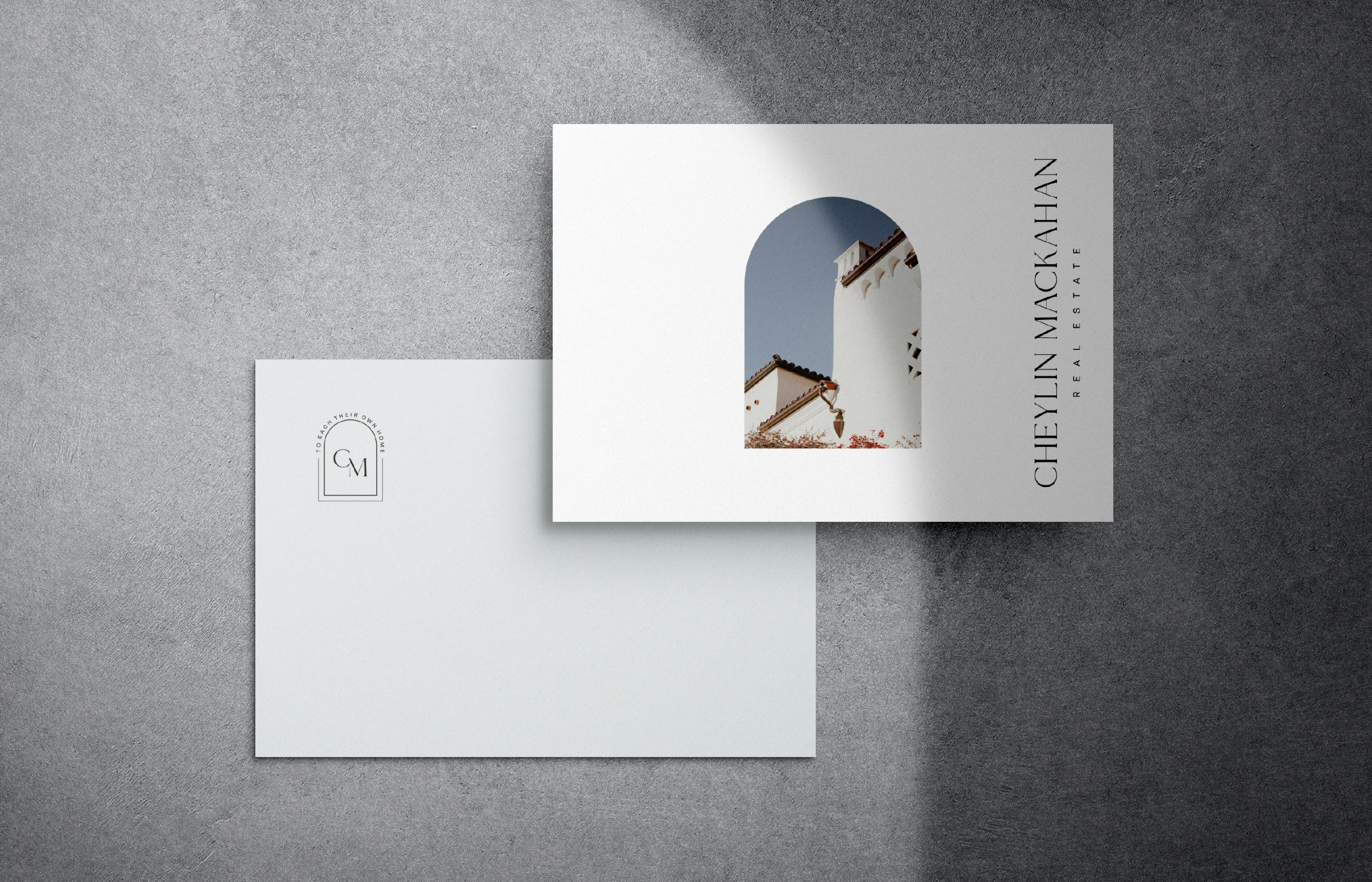 Brand stationery mockup with overlapping cards on a textured gray background