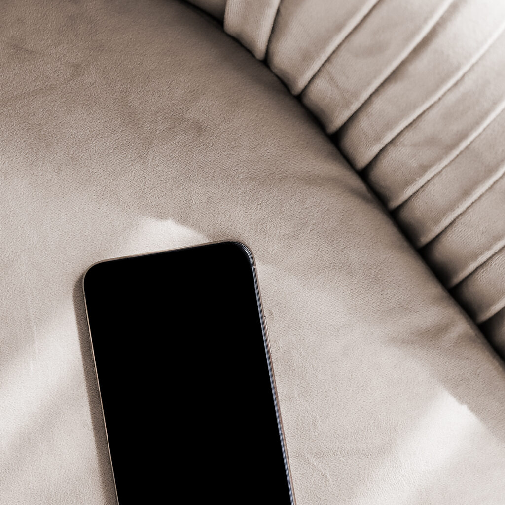 Smartphone on a cushioned neutral fabric surface